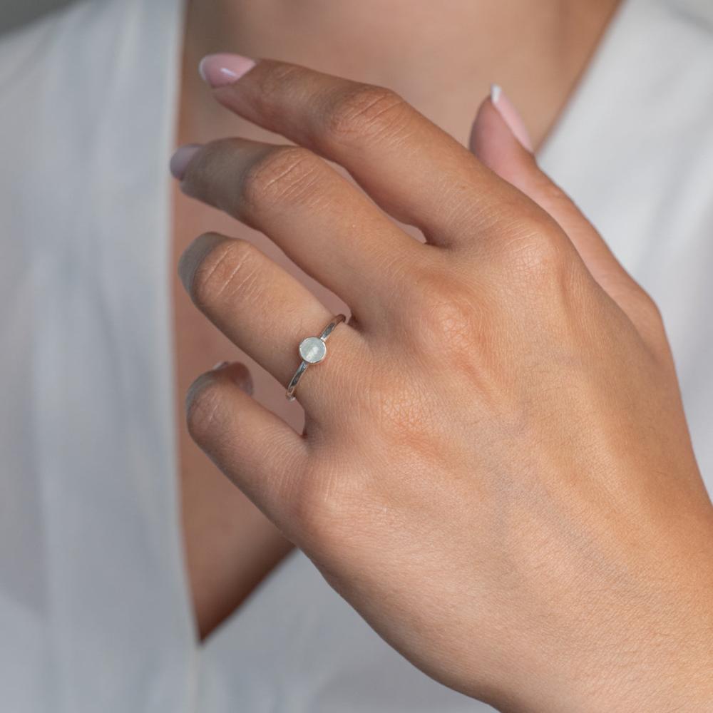 Aquamarine Sterling Silver Hammered Stacking Ring worn on a models hand with french nails.