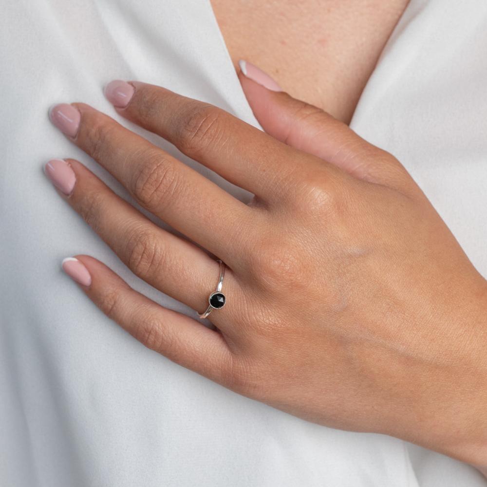 Model wears Black Spinel Hammered Sterling Silver Ring , with a white blouse and frenchtip manicured nails.