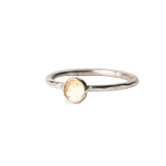 Citrine Rosecut Gemstone set on a hammered textured Sterling Silver Ring dispolayed on a white background