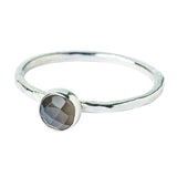 Model wears Grey Moonstone Hammered Sterling Silver Stacking Ring , with a white blouse and frenchtip manicured nails.