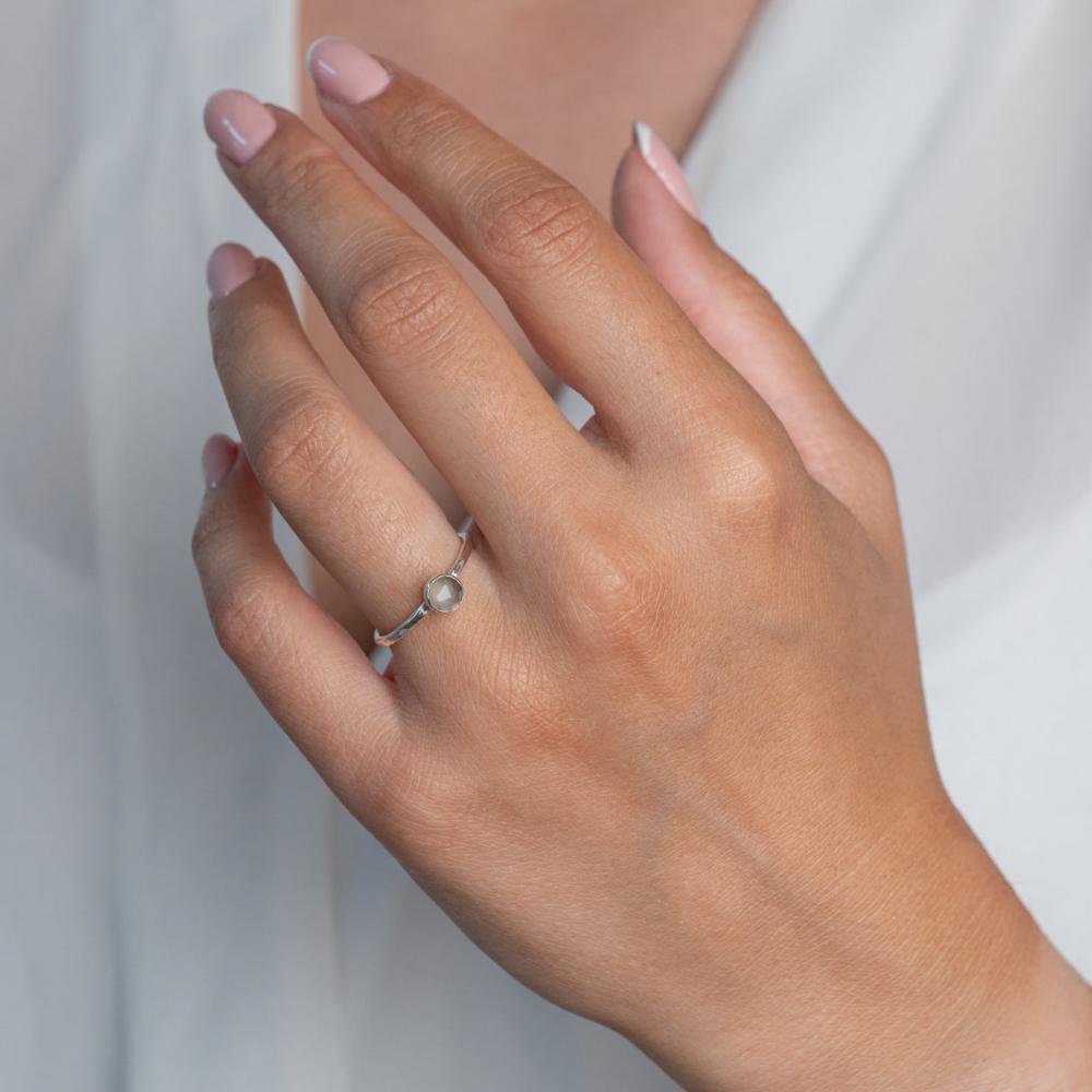 Model wears Grey Moonstone Hammered Sterling Silver Stacking Ring , with a white blouse and frenchtip manicured nails.