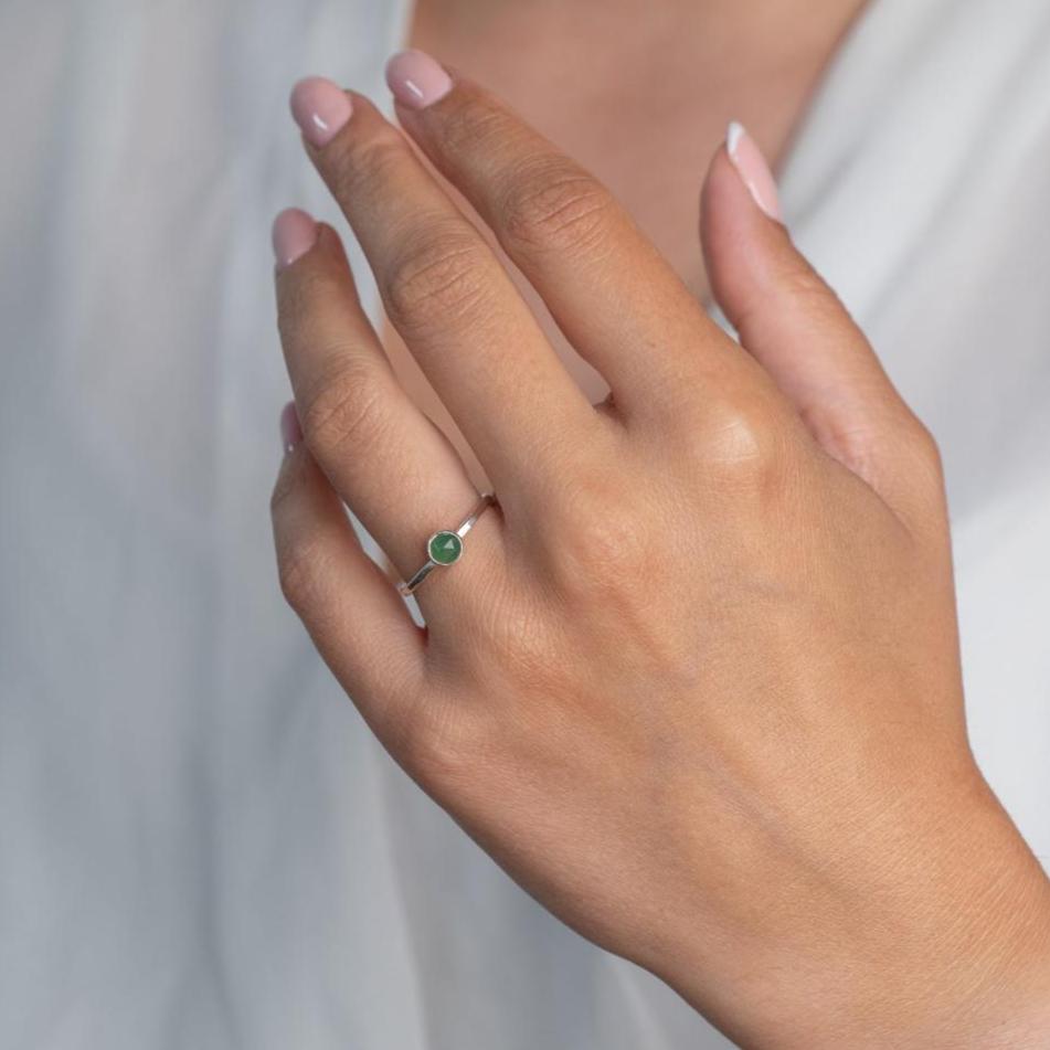 Model wears Jade Hammered Sterling Silver Ring , with a white blouse and frenchtip manicured nails.