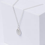 Sterling Silver Moonstone Pendent Necklace, shown at an angle on a white box.