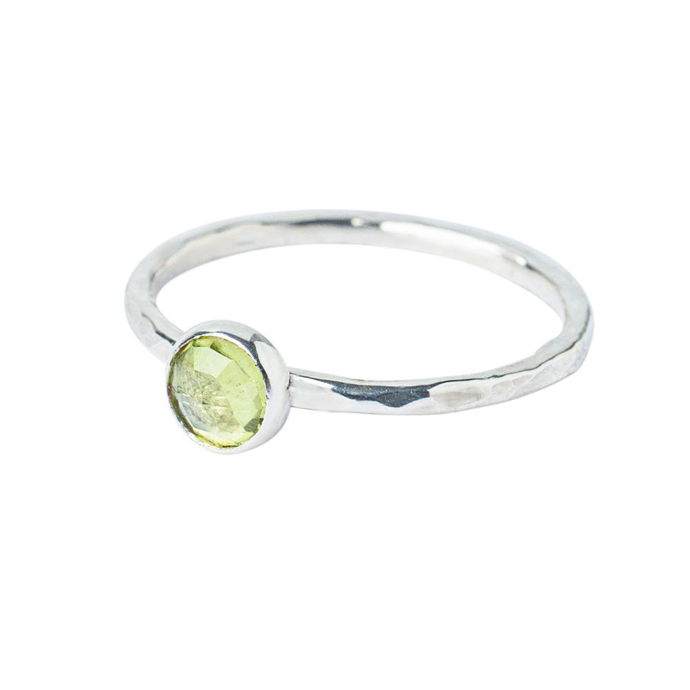 Peridot Gemstone Hammered Texture band, Sterling Silver Ring on a white background 