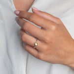 Model wears PeridotHammered Sterling Silver Ring , with a white blouse and frenchtip manicured nails.