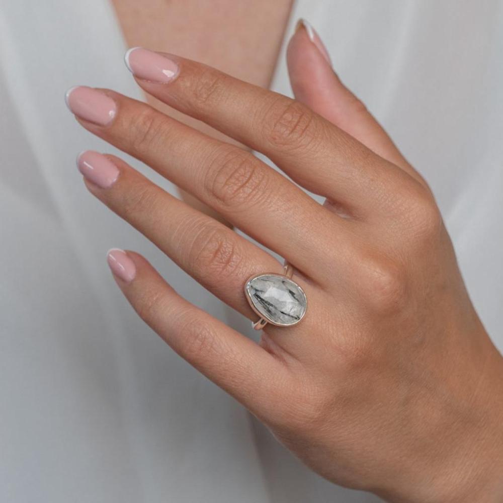 Sterling Silver Rutilated Black Statement Ring worn on model's left hand.