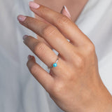 Model wears Turquoise Hammered Sterling Silver Ring , with a white blouse and frenchtip manicured nails.