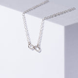 Infinity Sterling Silver Necklace on White Background 