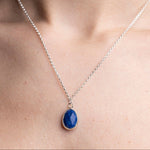 Handmade Lapis lazuli Gemstone Sterling Silver Pendent worn on a model.