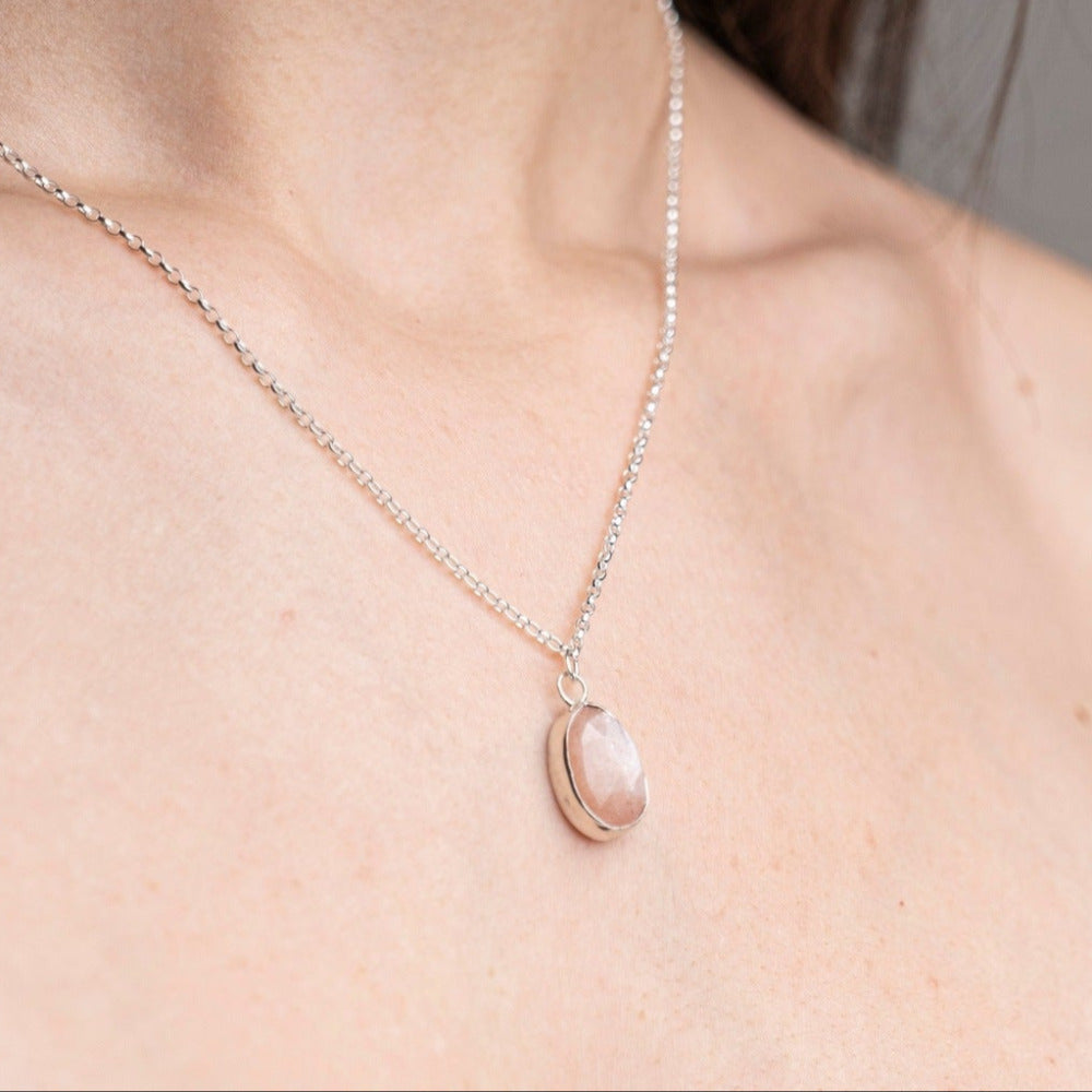 Peach Moonstone Gemstone Pendent Necklace, set in Sterling Silver worn on a model