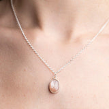 Peach Moonstone Gemstone Pendent Necklace, set in Sterling Silver, worn on a model