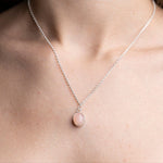 Handmade Pink Opal Gemstone Pendent set in Sterling Silver, worn on model 