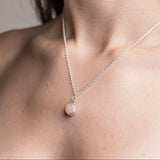 Handmade Pink Opal Gemstone Pendent set in Sterling Silver, worn on model 