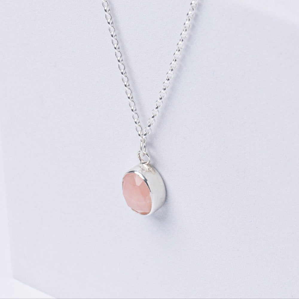 Handmade Pink Opal Gemstone Pendent set in Sterling Silver, displayed on a white box