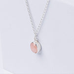 Handmade Pink Opal Gemstone Pendent set in Sterling Silver, displayed on a white box