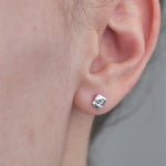 Sterling Silver Hammered Textured Earrings, Square shaped worn in models ear.