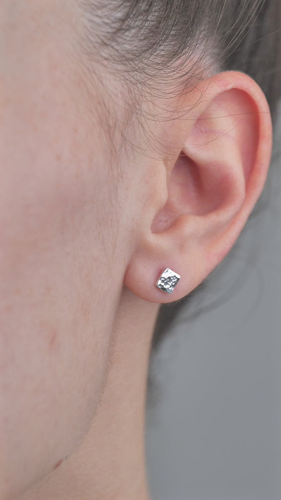 Sterling Silver Hammered Textured Earrings, Square shaped worn in models ear.