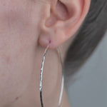 Sterling Silver Hoop Earrings with Hammered Texture worn by model