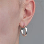 Sterling Silver Hoops with Hammered Texture worn by model.