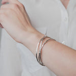 Sterling Silver Russian Bangles Sterling Silver worn on model's wrist