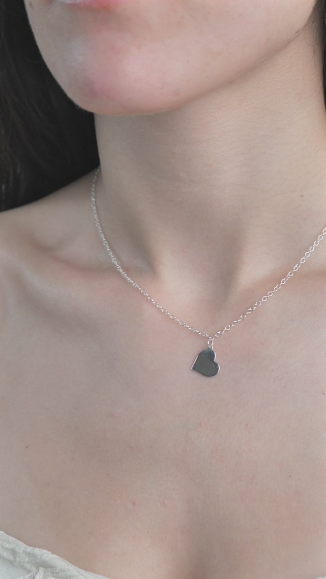 Sterling Silver Heart Shaped Necklace worn on model. 