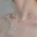 Sterling Silver Star Pendent Necklace worn on model.