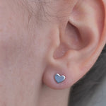 Sterling Silver Hearty Shaped Earrings worn in model's ear.