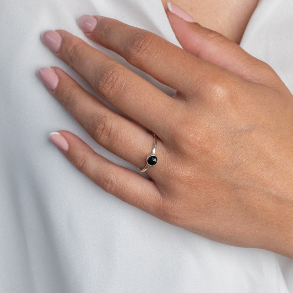 Handmade Labradorite Gemstone Ring in a Pear shape set in Sterling Silver, worn on a models left hand ring finger.