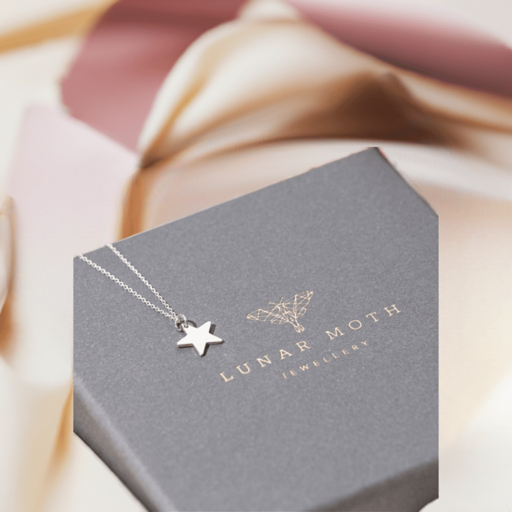 Star Pendent Sterling Silver Necklace displayed on Gift Box