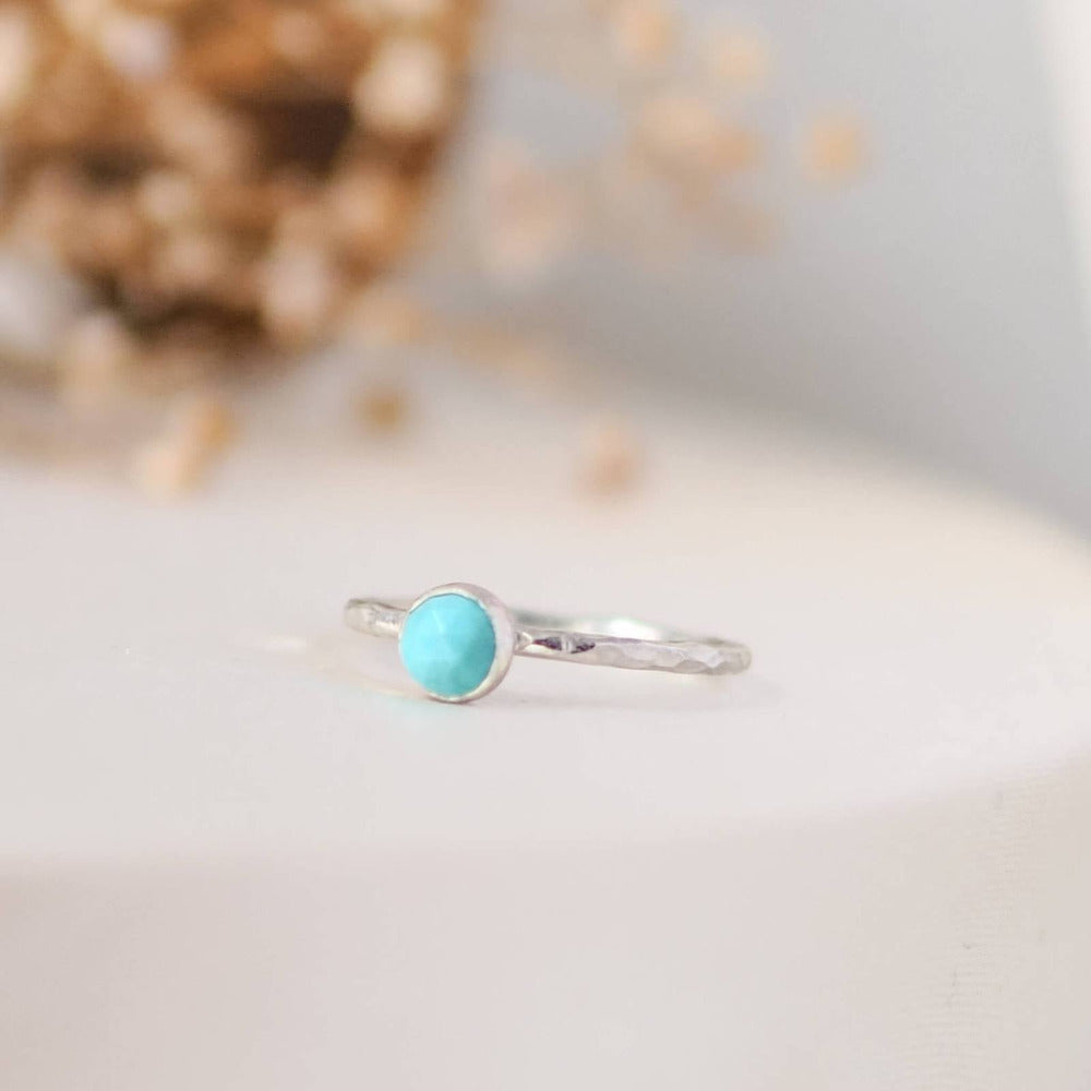 Turquoise gemstone Sterling Silver Stacking Ring with Hammered Textured band.  Silk background.